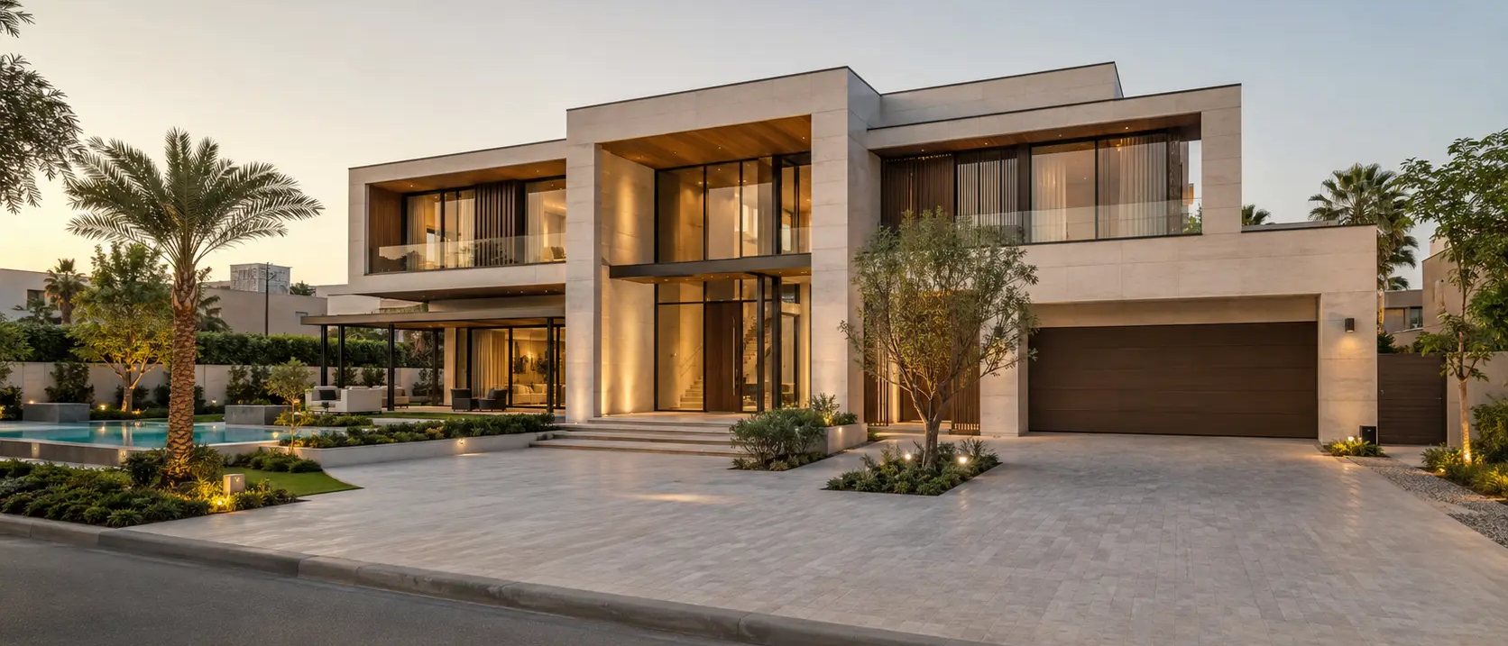 Completed luxury Dubai villa at dusk with warm interior lighting