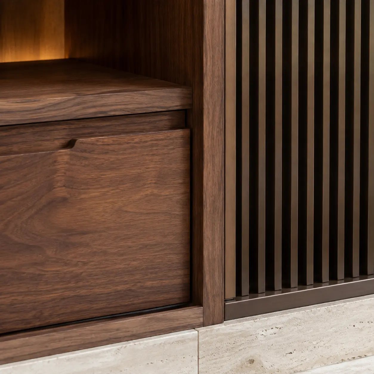 Precision walnut cabinet beside a fluted bronze architectural screen