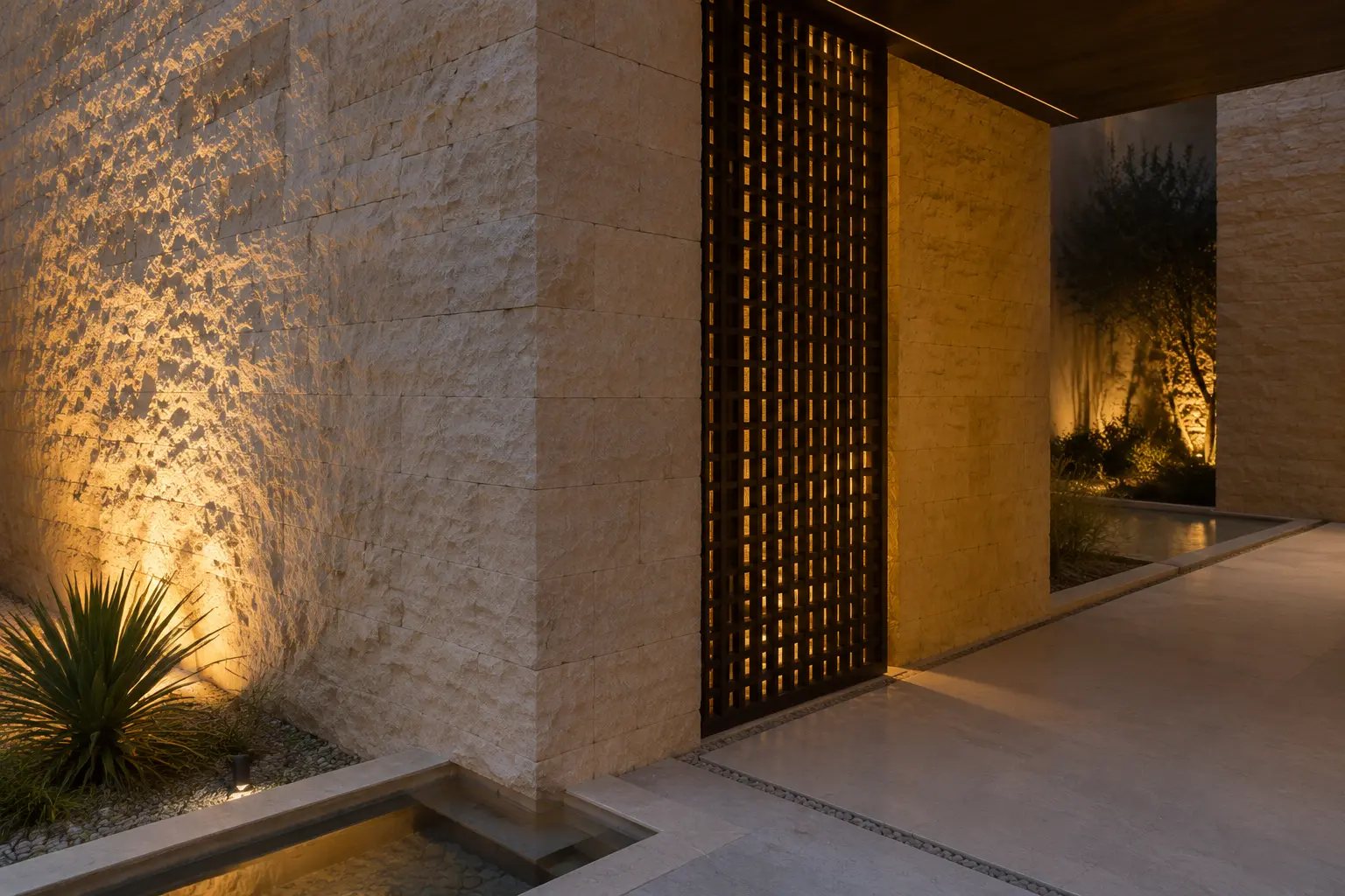 Rough limestone, bronze screen, concealed lighting and water-rill detail